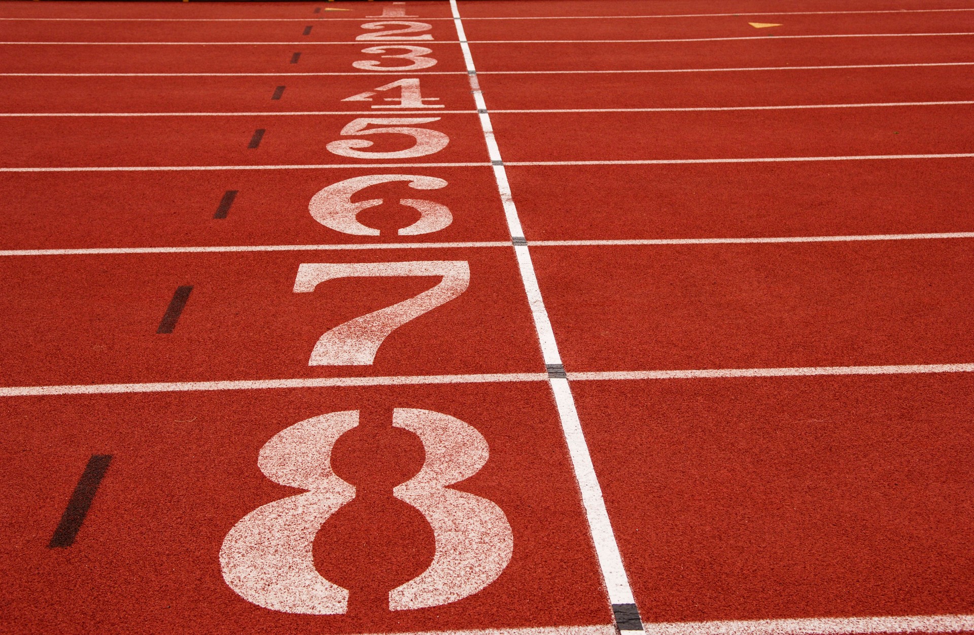 The start line of a track event is a critical point where athletes prepare to launch into their race.